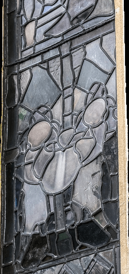 Damage of buckled stained glass window behind the main altar